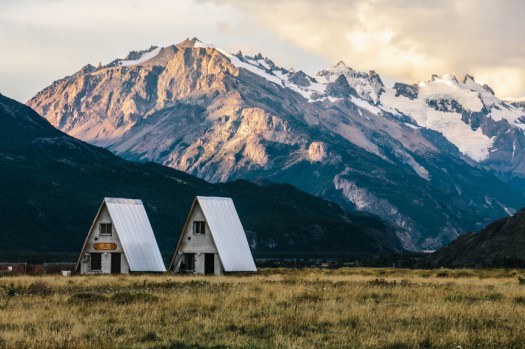Mountain view with small houses or huts at sunset on Patagonia